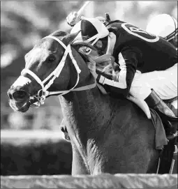  ?? KENNY MARTIN/COGLIANESE PHOTOS ?? Pay Any Price has won three consecutiv­e races, including this half-length victory Dec. 2 in the Claiming Crown Canterbury.