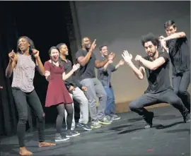  ?? Michael Robinson Chavez Los Angeles Times ?? AMID THE OSCARS’ diversity f lap, the CBS minority showcase performers do a warmup dance before taking the stage Thursday night at the El Portal Theatre.