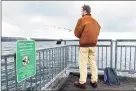  ?? Arnold Gold / Hearst CT Media ?? Ethan Whitner of New Haven fishes in New Haven Harbor from a pier off South Water Street on Tuesday.