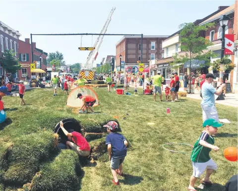  ?? WENTWORTH LANDSCAPE PHOTOS ?? Downtown Picton sprouted a giant lawn last month on Canada Day weekend - complete with Hobbit Hole.