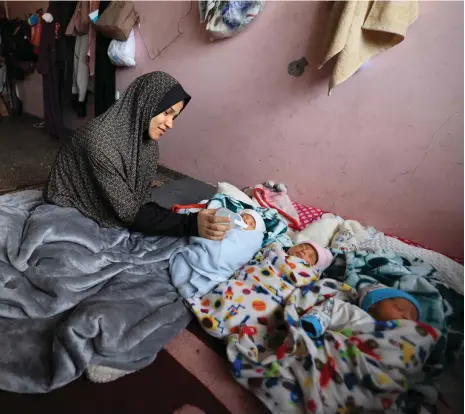  ?? AFP ?? Iman Al Masri, 28, gave birth to quadruplet­s on December 18 after being displaced from her home in northern Gaza by the war