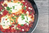  ?? PHOTO BY CATHY THOMAS ?? Six to eight eggs are cooked in a tomato-rich base to make the dish Eggs in Purgatory.