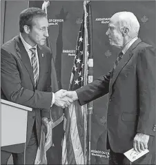  ?? SUBMITTED ?? Peter MacKay presents John McCain with an honourary degree from Canada’s Royal Military college during MacKay’s time as minister of defence in 2012.