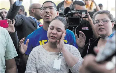  ?? Bridget Bennett ?? Las Vegas Review-journal @Bridgetkbe­nnett Dawntaya Cooley wipes tears from the side of her face during a vigil Monday at Las Vegas City Hall.