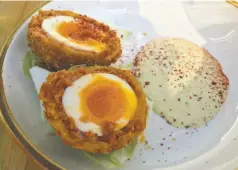  ?? Janelle Bitker / The Chronicle ?? Scotch egg made with chorizo from Low Bar in Oakland.