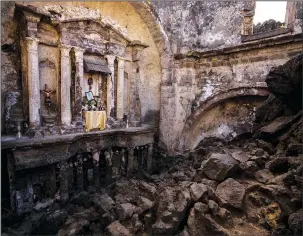  ?? (AP/Eduardo Verdugo) ?? An altar, adorned with religious relics, is seen Feb. 21 inside the church buried decades ago by lava from the Paricutin volcano.