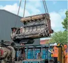  ??  ?? The engine is lifted out of Class 08 No. 08635 at Kiddermins­ter diesel depot. PHIL SEYMOUR/SVR