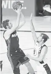  ?? KIM KLEMENT/AP ?? Goran Dragic (7) shoots over Indiana Pacers guard T.J. McConnell during Game 3 on Satuday.