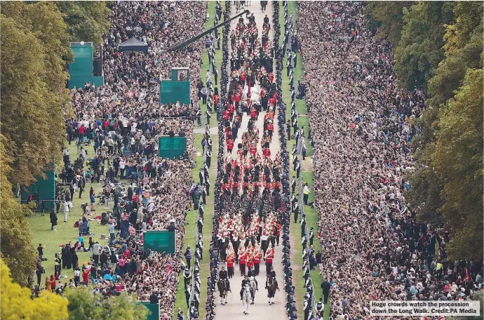  ?? ?? Huge crowds watch the procession down the Long Walk. Credit:PA Media