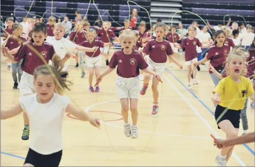  ?? PICTURE: TONY JOHNSON ?? UP IN THE AIR: Youngsters enjoy the first ever Leeds City Skipping School sinal in the sports arena at Leeds Beckett University Headingley Campus.