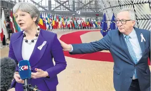  ??  ?? Theresa May is greeted by EU boss Jean-Claude Juncker in Brussels yesterday