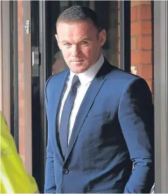  ?? Picture: Getty. ?? Footballer Wayne Rooney leaving Stockport Magistrate­s Court after facing a drink-driving charge.