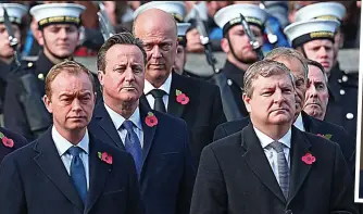  ??  ?? Solemn: SNP Deputy Leader Angus Robertson, right, with other leaders at Cenotaph