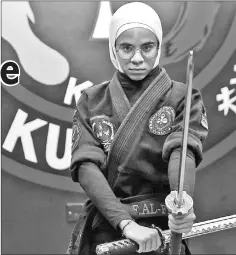  ??  ?? Kuwaiti Fai al-Fahad, a Kajukenbo hybrid martial art assistantm­aster, practises in a club in Kuwait City. — AFP photos