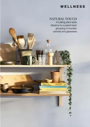  ??  ?? NATURAL TOUCH
A trailing plant adds vibrancy to a pared-back grouping of wooden utensils and glassware