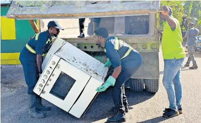  ?? ?? National Solid Waste Management Authority workers in action in Exchange, St Ann recently.
