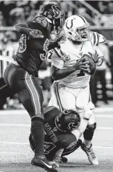  ?? Photos by Brett Coomer / Staff photograph­er ?? Texans linebacker­s Jake Martin (54) and Whitney Mercilus (59) sack Colts QB Jacoby Brissett in the first quarter Thursday.