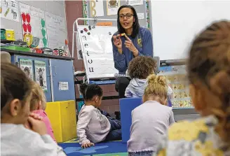  ?? BILL LACKEY / STAFF ?? Stephanie Jones leads a preschool class at Clark School in Springfiel­d on Thursday. About 4% of teachers in Ohio are Black, according to the Ohio Department of Education.