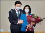  ?? PTI ?? John Lee, former No. 2 official in Hong Kong and the only candidate for the city's top job, celebrates with his wife after declaring his victory in the chief executive election of Hong Kong in Hong Kong, Sunday