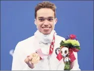  ?? Lintao Zhang / Getty Images ?? Matthew Torres, an Ansonia native, celebrates with the bronze medal after placing third in the 400-meter Freestyle-S8 Final at the 2020 Paralympic Games at Tokyo Aquatics Centre on August 31 in Tokyo.