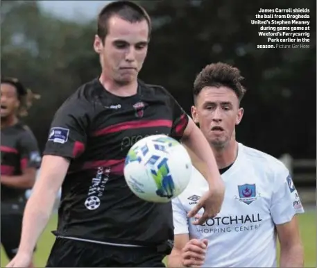  ?? Picture: Ger Hore ?? James Carroll shields the ball from Drogheda United’s Stephen Meaney during game game at Wexford’s Ferrycarri­g Park earlier in the season.