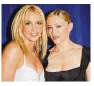  ?? GETTY IMAGES ?? Britney Spears (left), and Madonna pose backstage during the 2003 MTV Video Music Awards.