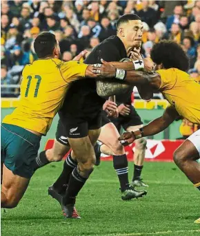  ??  ?? Outta my way: New Zealand All Blacks player Sonny Bill Williams trying to outsmart Australian players Curtis Rona and Henry Speight. — Reuters