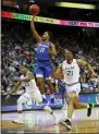  ?? NOAH K. MURRAY — THE ASSOCIATED PRESS ?? DePaul’s Charlie Moore (11) goes to the basket against Seton Hall’s Shavar Reynolds (33) and Ike Obiagu (21) on Wednesday in Newark, N.J.