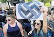  ?? Chip Somodevill­a Getty Images ?? IN CHARLOTTES­VILLE, VA., protesters shout anti-Nazi chants days after a white supremacis­t rally.