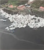  ?? Photos provided by The Associated Press ?? BELOW: This photo provided by Caribbean Buzz shows boats clustered together after Hurricane Irma in the U.S. Virgin Islands.