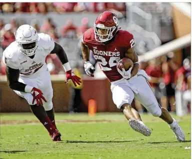  ?? BRETT DEERING / GETTY IMAGES ?? Oklahoma running back Rodney Anderson, rushing against Florida Atlantic, is out for the rest of the season after tearing a knee ligament against UCLA. His loss hurts the Big 12’s visibility and prestige.
