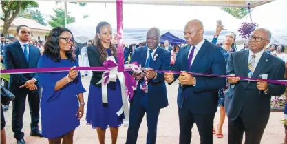  ??  ?? Avon Dialysis Centre Launch 1: The Representa­tive of the Commission­er of Health, Lagos State, Dr. Taiwo Lawal (middle) cutting the tape at the launch of the state-of-the-art Avon Dialysis Centre, Lagos, supported by Chairman Heirs Holdings, Tony O. Elumelu(2nd right); President, Heirs Holdings, Mr. Emmanuel Nnorom; CEO, Avon Medical Practise, Dr(Mrs) Awele Elumelu; and Medical Director, Avon Medicals, Dr Lillian Ekpo, in Lagos recently