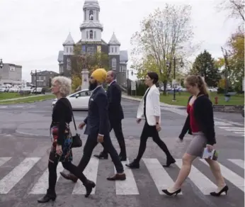  ?? JACQUES BOISSINOT/THE CANADIAN PRESS ?? NDP Leader Jagmeet Singh gets out and about in Alma, Que., last week, joined by, from left, local candidate Gisele Dallaire, NDP MPs Guy Caron and Karine Trudel and party staffer Anne-Marie Aubert.