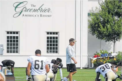  ?? Inset: Steve Helber / Associated Press; Above: Chris Tilley / Associated Press ?? Jim Justice (inset), a West Virginia billionair­e — and, since January, the governor of his home state — has owned The Greenbrier since 2009. He was instrument­al in bringing the New Orleans Saints to the facility, which was built for their use, for the...