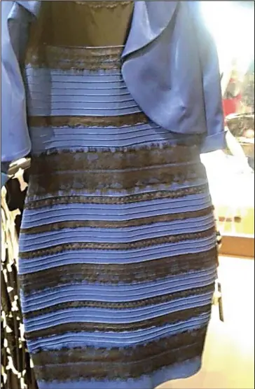  ??  ?? White and gold or blue and black? The photograph has divided opinion across the globe