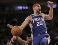  ?? SET WENIG — THE ASSOCIATED PRESS ?? The Sixers’ Ben Simmons reacts after dunking during the first half of a win over the Knicks in New York Sunday.