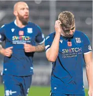  ??  ?? A disappoint­ing night for Dundee pair Sean Mackie and Jordon Forster.