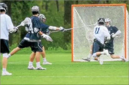  ?? ANNE NEBORAK — DIGITAL FIRST MEDIA ?? Episcopal Academy’s Jake Martellucc­i Malvern Prep goalie Andrew Clark. (11) fires home what proves to be the game-winning goal past