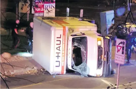  ?? MICHAEL MUKAI/AFP/ GETTY IMAGES ?? A rental truck lies on its side after it was allegedly used to mow down pedestrian­s on Jasper Avenue Sept. 30. The man charged with the crime, as well as being charged with attempting to kill a police officer, has been deemed mentally fit to stand trial.