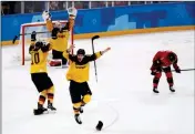  ?? ASSOCIATED PRESS ?? GERMANY PLAYERS CELEBRATE after the semifinal round of the men’s hockey game against Canada at the 2018 Winter Olympics in Gangneung, South Korea, Friday. Germany won 4-3.