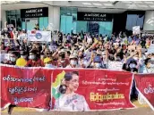  ?? AP/PTI ?? Demonstrat­ors display three-fingered salute, a symbol of resistance at an intersecti­on in Yangon, Myanmar on Wednesday.