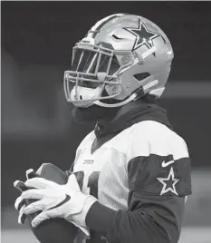  ?? TONY GUTIERREZ/AP ?? RB Ezekiel Elliott was absent from the first day of Cowboys camp in California.