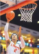  ?? PHOTO CREDIT ?? University of New Mexico forward Vance Jackson goes up for two of his six points during the Lobos’ 92-71 win over Eastern New Mexico on Wednesday.