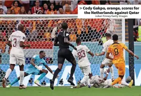  ?? Julian Finney/Getty Images ?? Cody Gakpo, orange, scores for the Netherland­s against Qatar