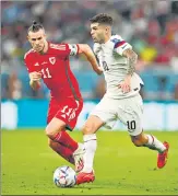  ?? REUTERS ?? Wales's Gareth Bale in action with Christian Pulisic of the US during their World Cup match on Monday.