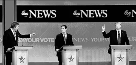  ?? JOE RAEDLE/GETTY IMAGES ?? Republican presidenti­al candidate Marco Rubio, center, is criticized by Jeb Bush, left, in Saturday’s debate that featured Donald Trump and four others.