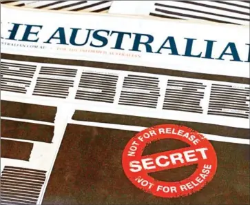  ?? SAEED KHAN/AFP ?? Newspapers across Australia ran heavily redacted front pages on Monday to protest against government secrecy and a crackdown on press freedom.