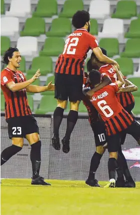  ??  ?? Al Rayyan players celebrate their goal against Al Ahli in the QNB Stars League yesterday. PICTURE: Jayan Orma