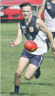  ??  ?? Nar Nar Goon’s Luke Horvath chases the loose ball during the under 18 match; Photograph­s: Michael Robinson.