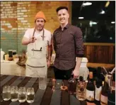  ?? Special to The Okanagan Weekend ?? Salt and Brick chef James Holmes, left, and manager Rowan Henderson celebrate Henderson’s win at Thursday night’s Okanagan Spirits Craft Distillery Mixoff.